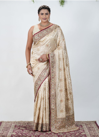 Golden Cream And Maroon Embroidered Shimmer Net Saree
