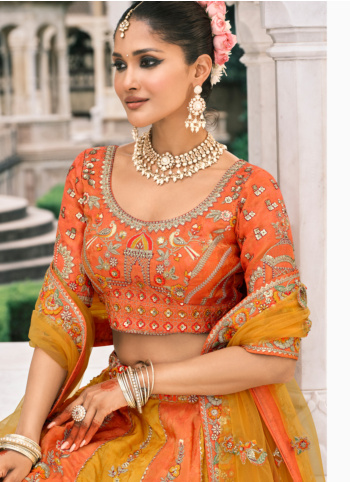 Graceful Yellow And Orange Embroidered Lehenga Choli With Dupatta
