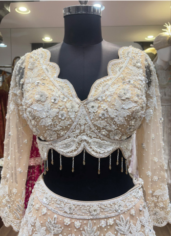 Ivory Color Embroidered Net Fabric Lehenga Choli