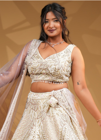 Ivory Silk Hand Embroidered Bridal Lehenga Set With Pink Net Dupatta