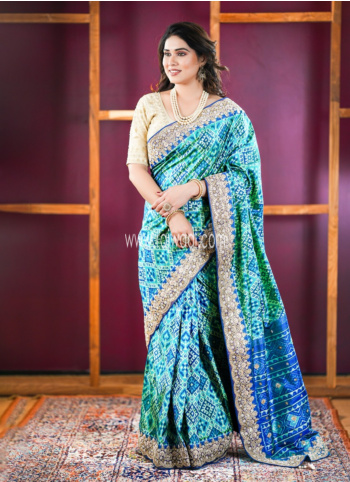 Rama And Blue Embroidered Patola Silk Saree