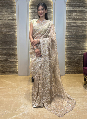 Beige color Embroidered Tissue Saree