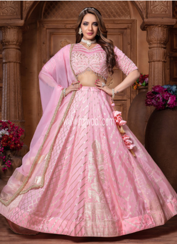 Exquisite Pink Woven Lehenga With Embroidered Choli