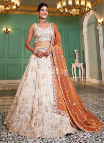 Shimmering Off White Embroidered Tissue Silk Lehenga Choli